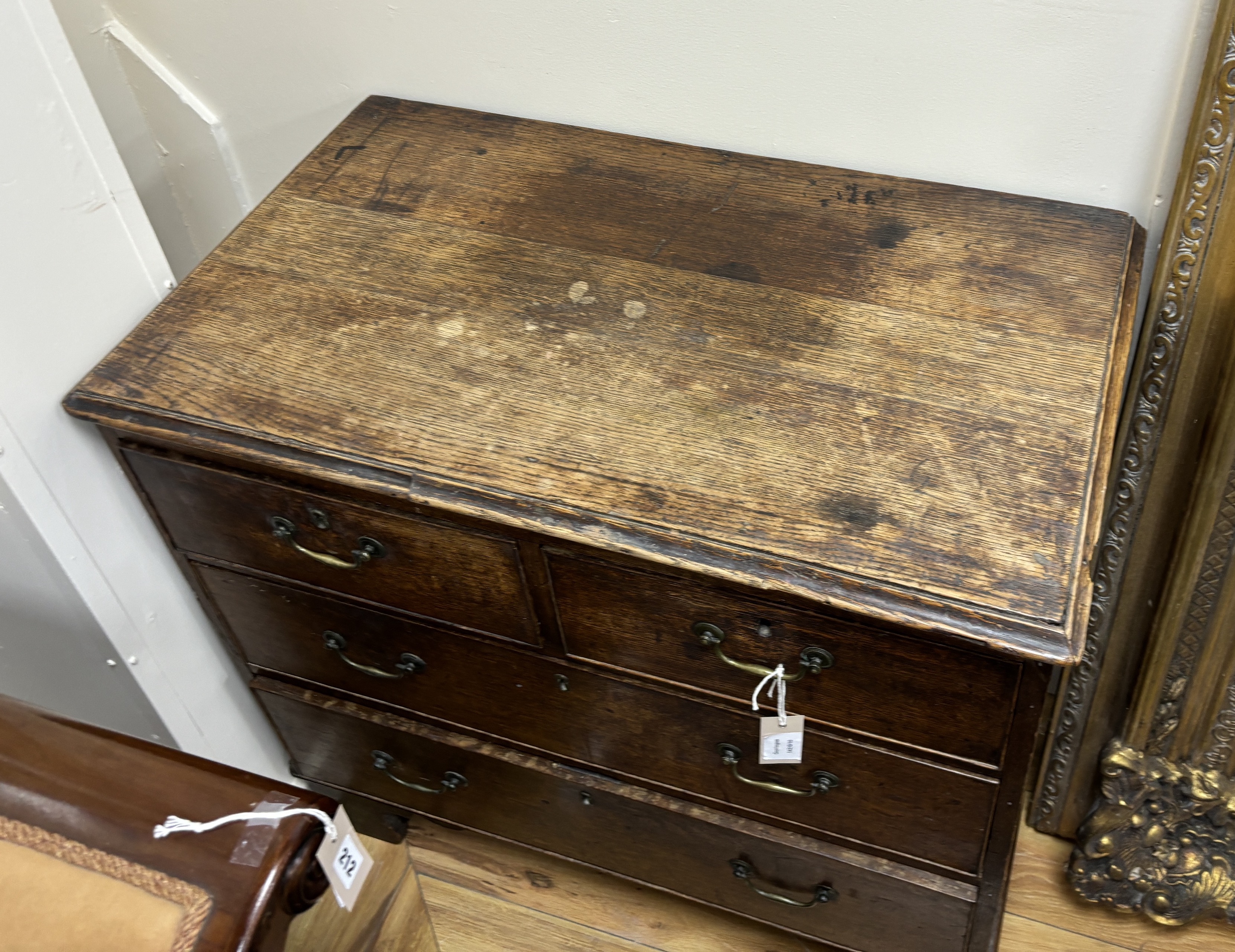 A small George III oak chest of four drawers, width 84cm, depth 49cm, height 79cm